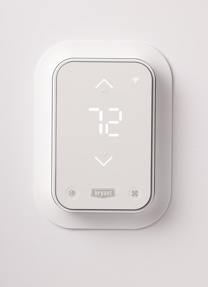 Smart thermostat on wall